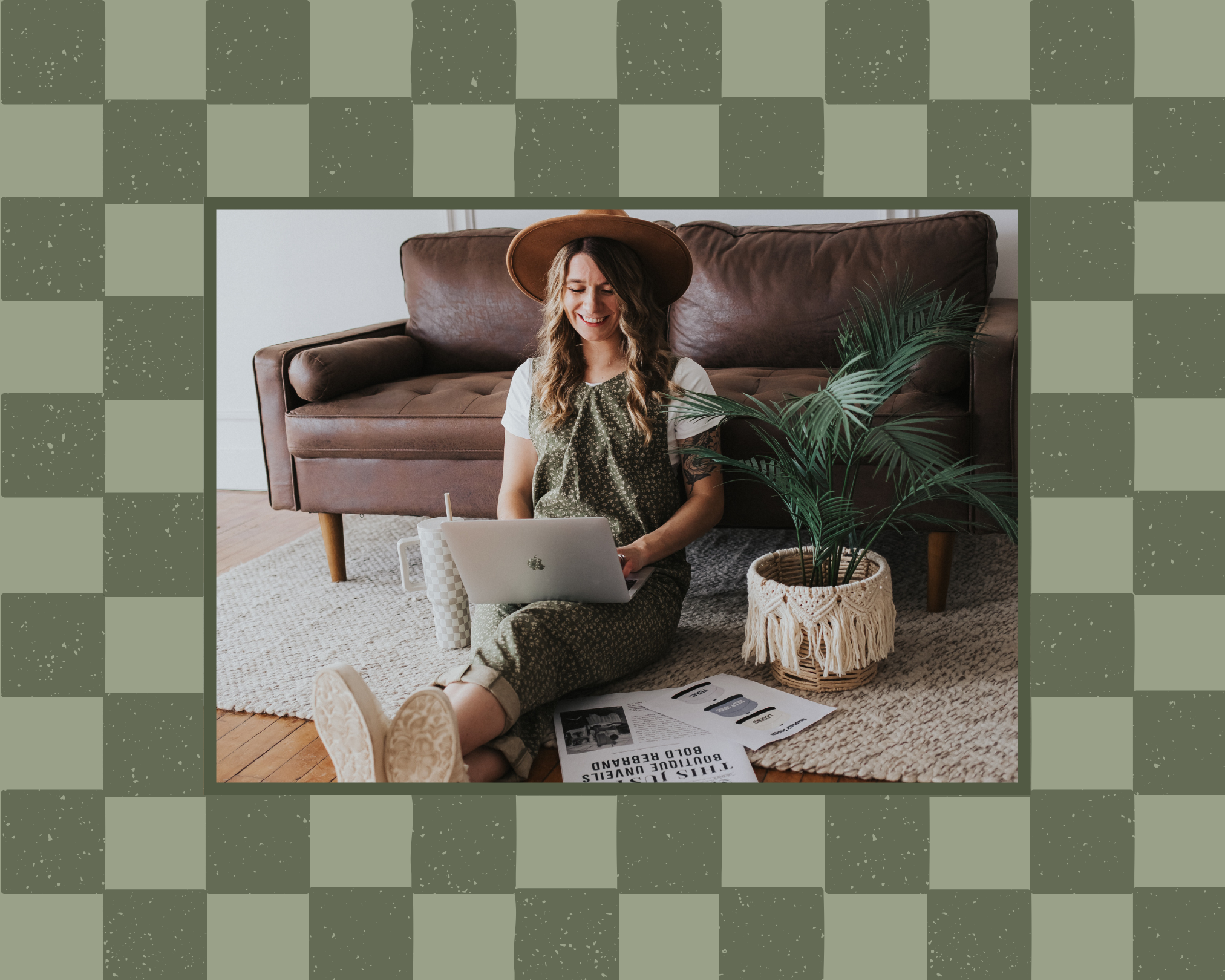 Founder of Raising Brave wearing a stylish and modern green jumpsuit while she works on her laptop