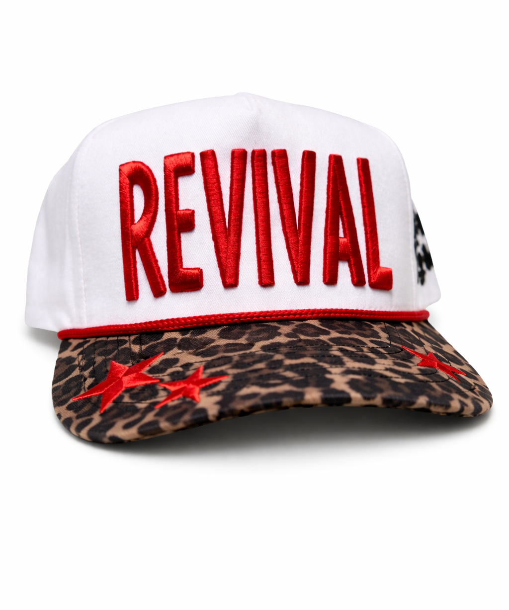 White cap with red 'REVIVAL' text and leopard print brim on a white background