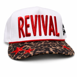 White cap with red 'REVIVAL' text and leopard print brim on a white background