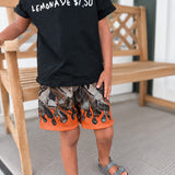 Child wearing a black t-shirt with 'LEMONADE $1.00' text, patterned shorts, and sandals on a porch.