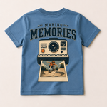 Blue t-shirt with a graphic of a camera and a person on a skateboard, labeled 'Making Memories'.