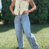 Women in Embroidered Floral Jeans Outside.
