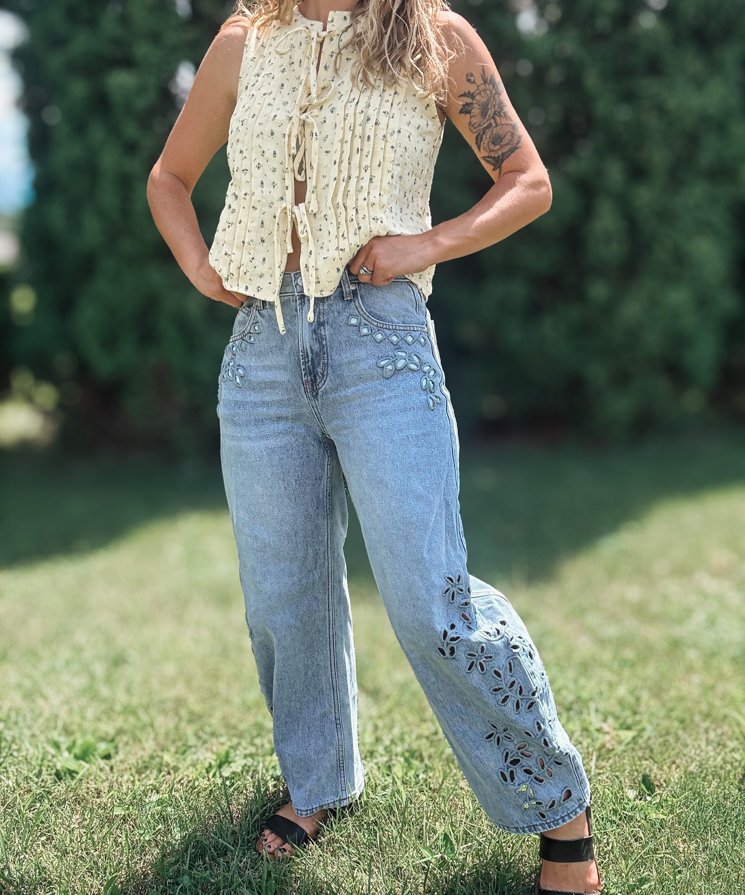 Women in Embroidered Floral Jeans Outside.