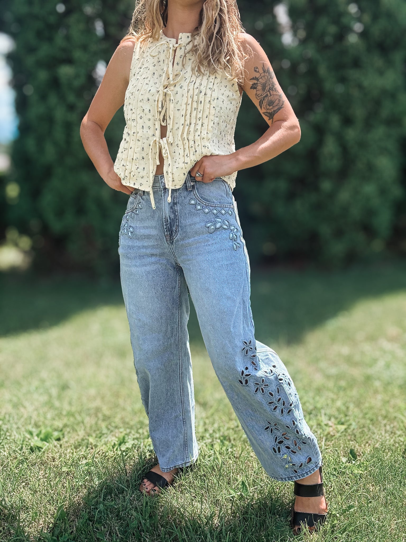 Women in Embroidered Floral Jeans Outside.