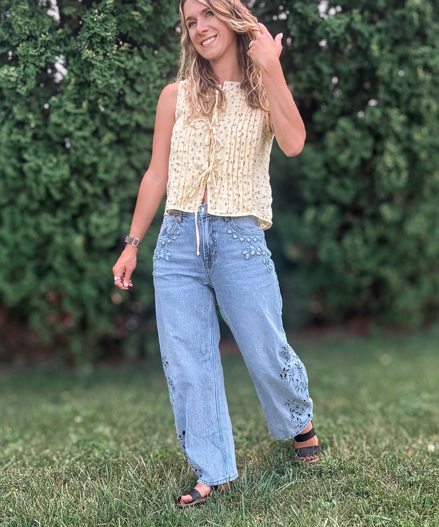 Women in Embroidered Floral Jeans Outside.