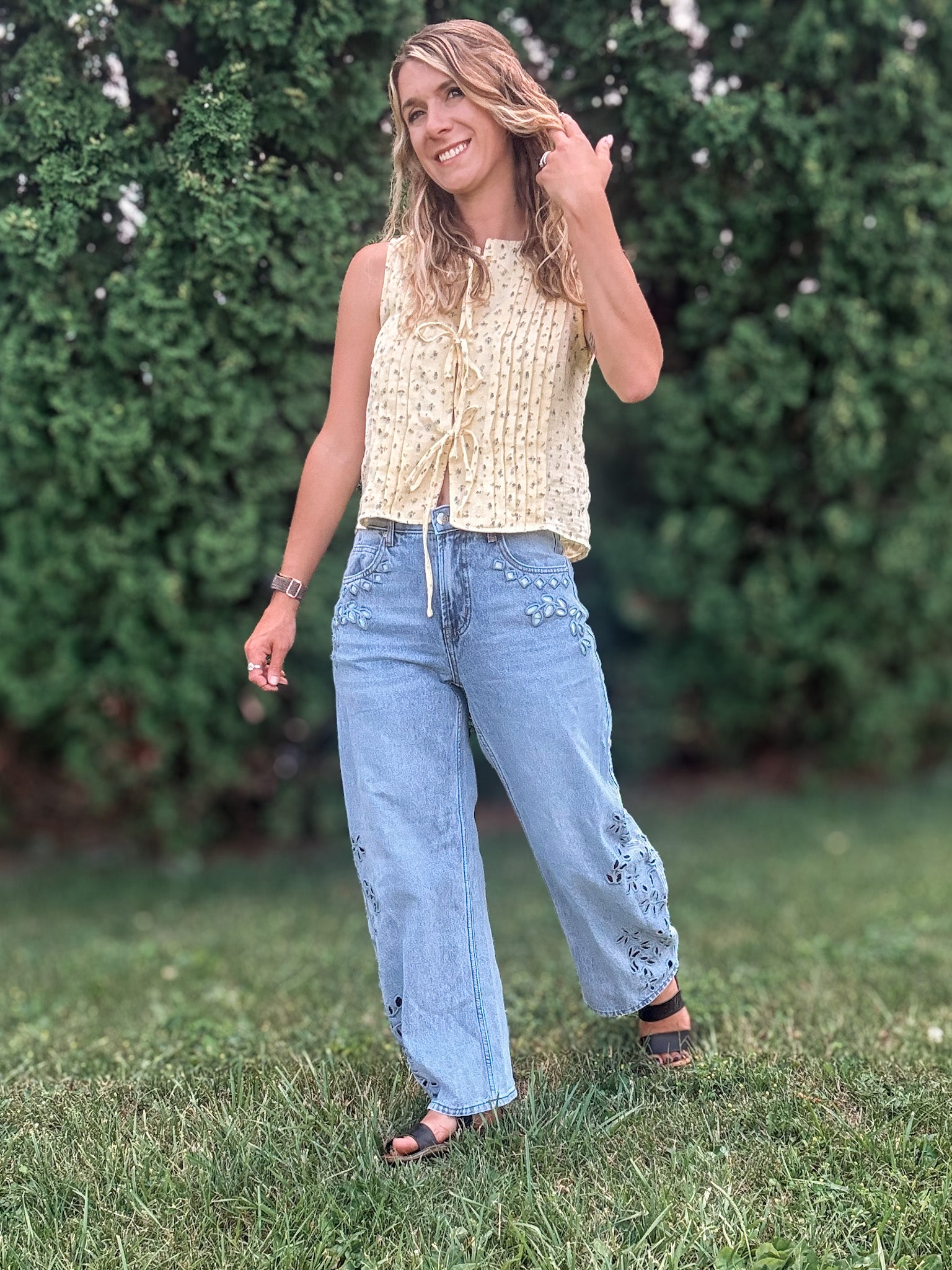 Women in Embroidered Floral Jeans Outside.