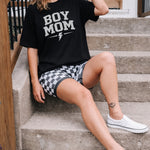 Women sitting on steps wearing Boy Mom tee.