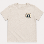 Beige t-shirt with a dirt bike plate with the number 23 on a white background