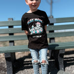 Child wearing a black skeleton Vacay Mode tee outside. 