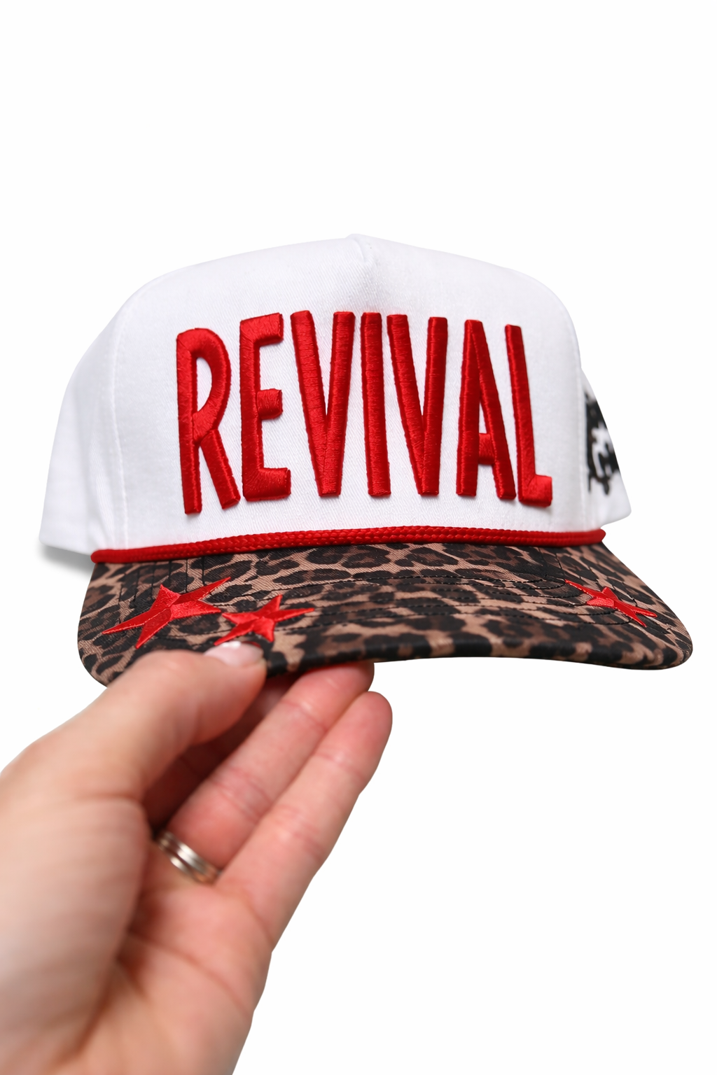 Cap with 'REVIVAL' text on a white background